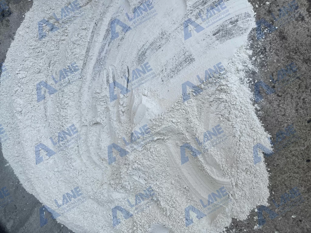 Diagram of the dry granulation process: from powder to flakes to final granules in a double roller press.